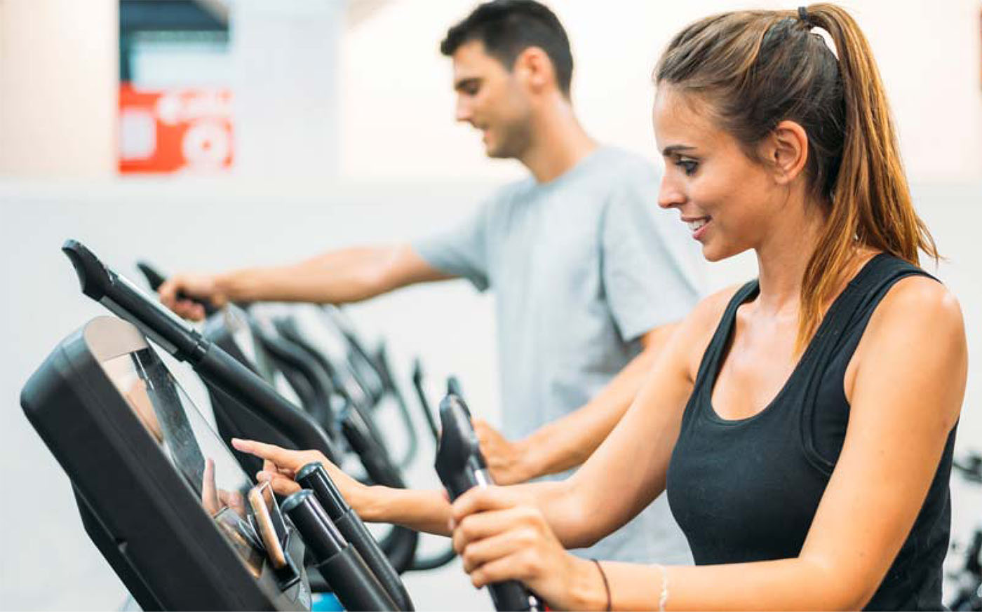 Couple Is Working Out On Step Climber Machine